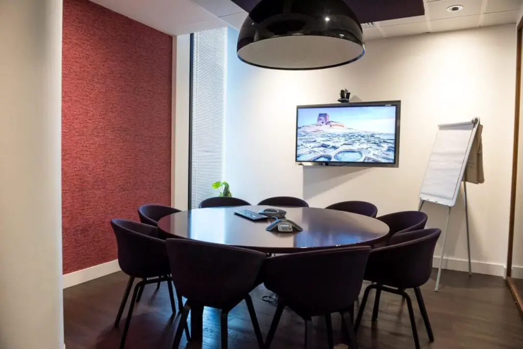 teleconference meeting room with table and chairs