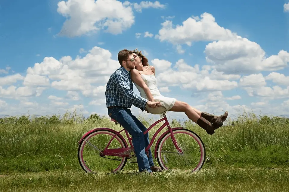 engagement couple romance on bike